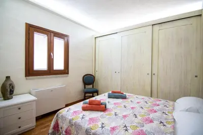 Letto o letti in una camera di Villa S'Olioni