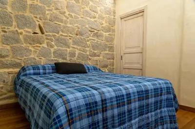Letto o letti in una camera di Villa S'Olioni