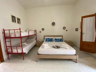 Letto o letti in una camera di GH Al Fortino Bilocale con Giardino