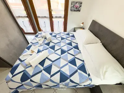 Letto o letti in una camera di Lumier