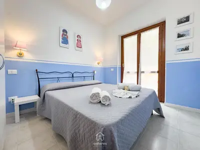 Letto o letti in una camera di Azzurra