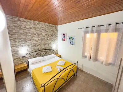Letto o letti in una camera di Domu Francisca