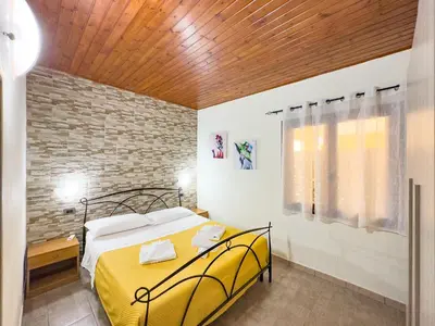 Letto o letti in una camera di Domu Francisca