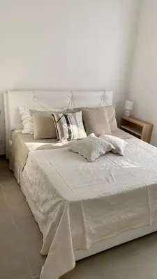 Letto o letti in una camera di Appartamento appena ristrutturato completo di tutti i comfort a un passo dal centro