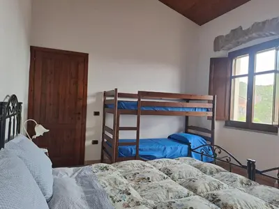 Letto o letti in una camera di B&B S'Omu Antiga