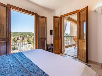 Letto o letti in una camera di Gente di Mare