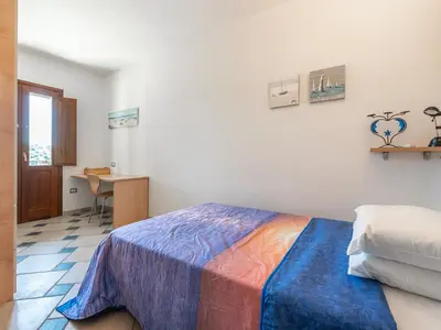 Letto o letti in una camera di Gente di Mare