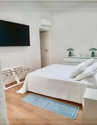 Letto o letti in una camera di La Bella Vita