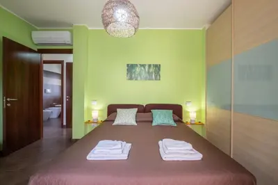 Letto o letti in una camera di Butterfly Apartment Cagliari - Self check-in, no kitchen