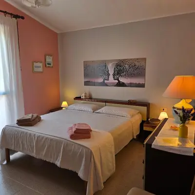 Letto o letti in una camera di La casa delle rose