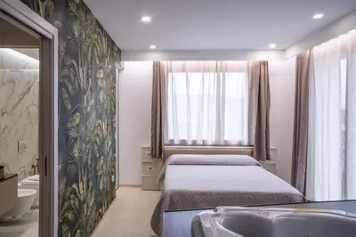Letto o letti in una camera di L'OLEANDRO Room's - Suite & Spa da Giuseppe
