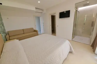 Letto o letti in una camera di L'OLEANDRO Room's - Suite & Spa da Giuseppe