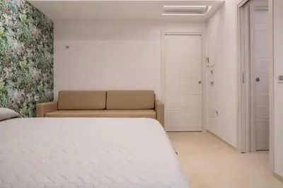 Letto o letti in una camera di L'OLEANDRO Room's - Suite & Spa da Giuseppe