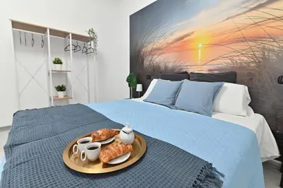 Letto o letti in una camera di IzzHome Cozy Room