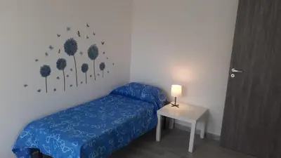 Letto o letti in una camera di Nuovo alloggio ampia veranda free wi-fi